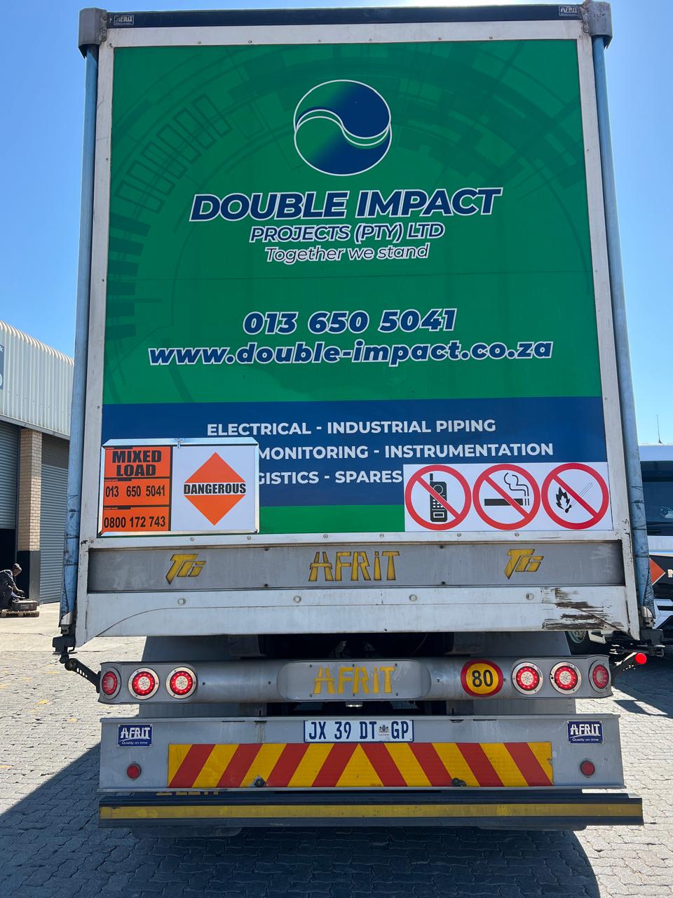 Double Impact Projects team in branded PPE inspecting plant on site
